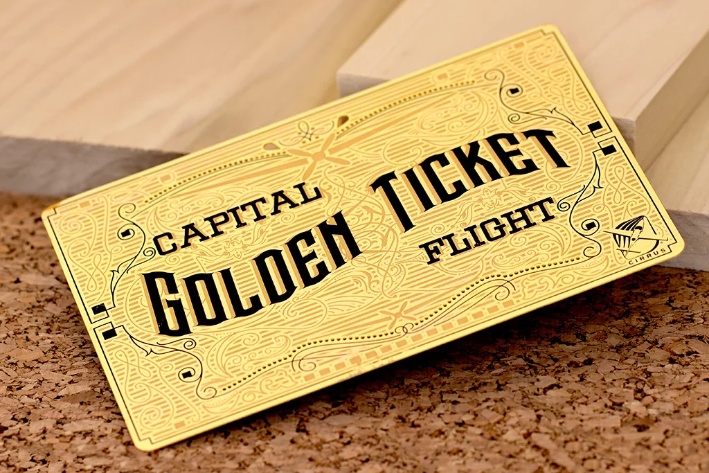 Gold-tone metal golden ticket invitation with custom engraving